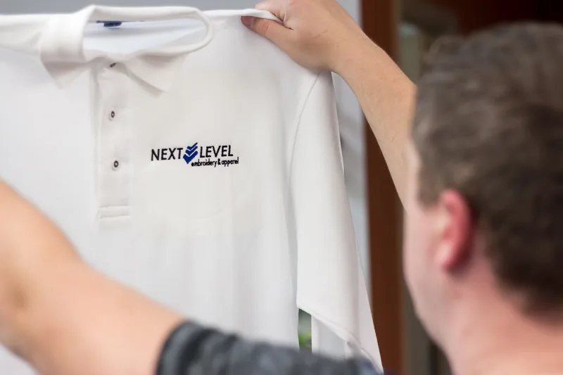 Finished white polo with a crisp embroidered logo