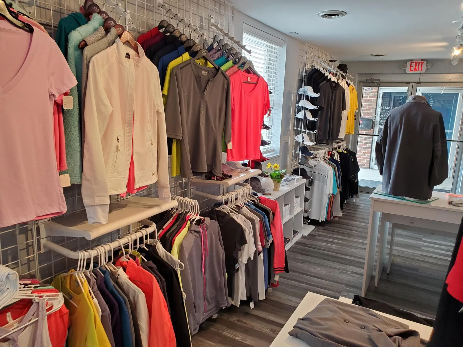 Racks of colorful apparel ready for printing