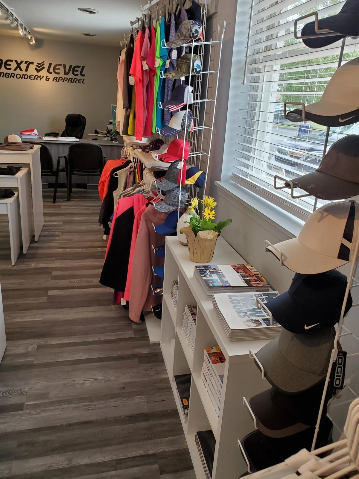 Hat wall and display shelves in the showroom