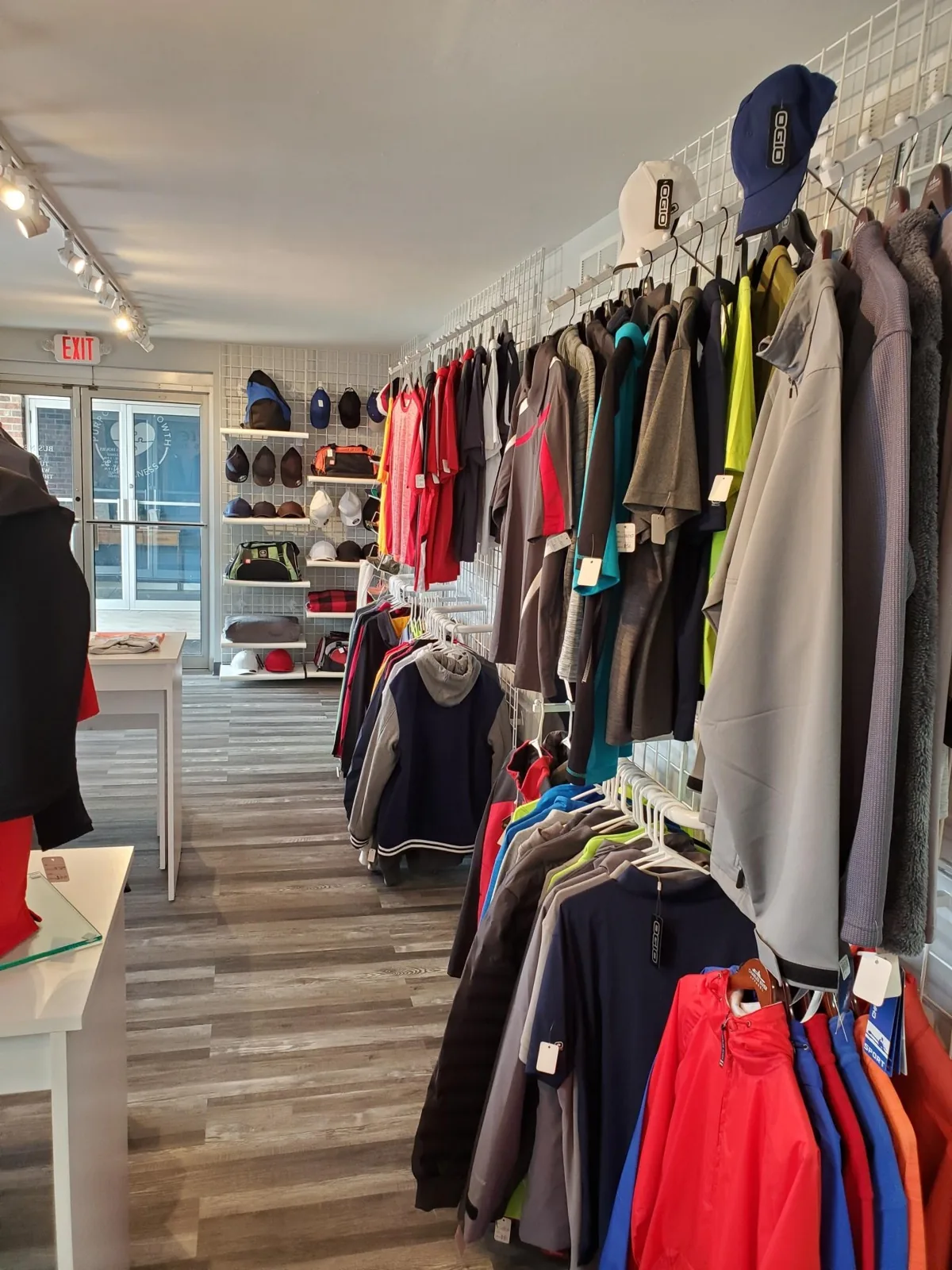 Racks of branded jackets and polos