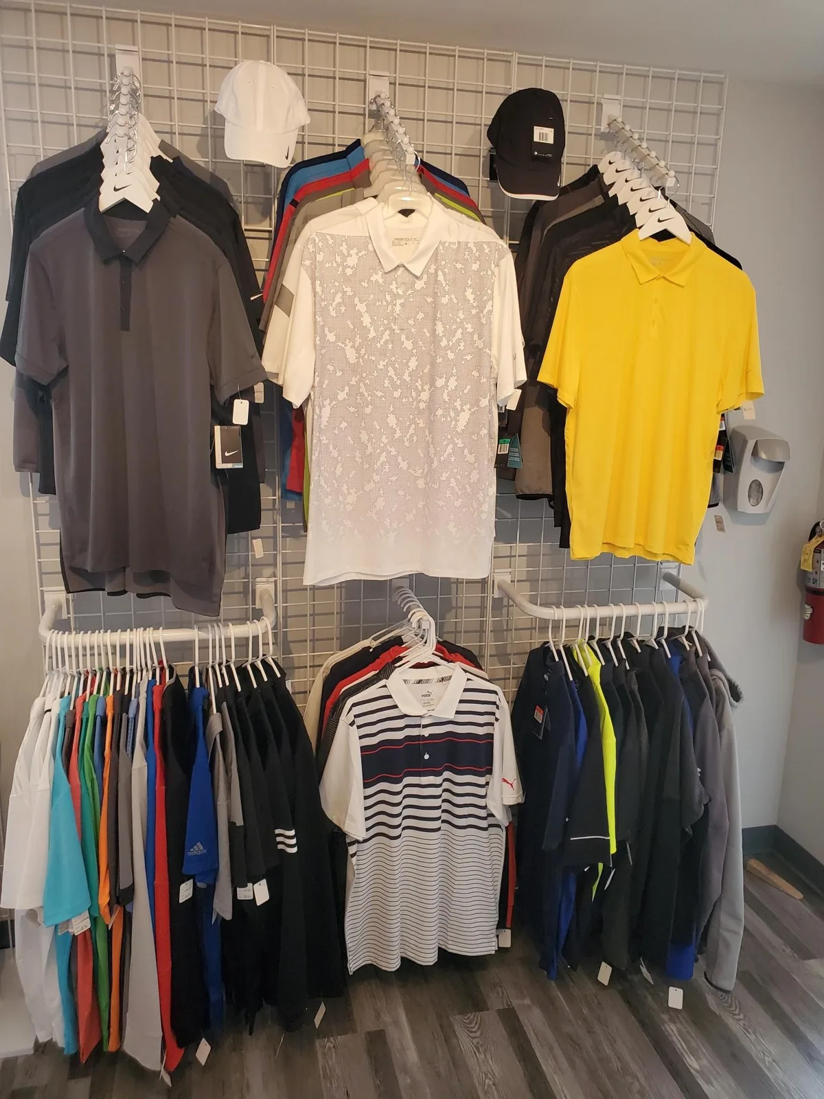 Wall of custom printed and blank shirts in the showroom