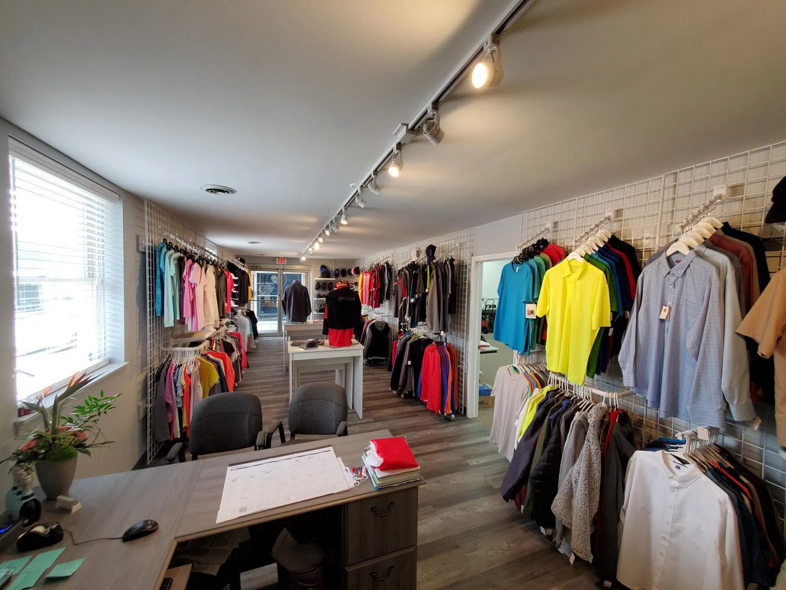 Wide view of the custom apparel showroom